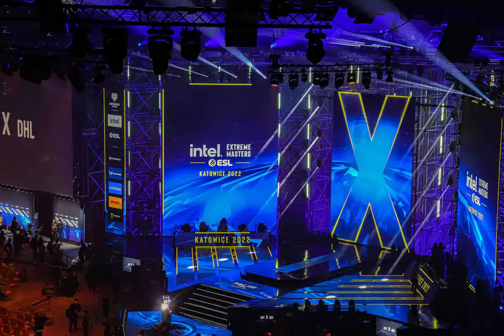 Dramatic view of a digital arena leaderboard showing top MOBA teams